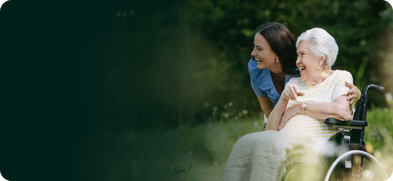 Caregiver supporting a resident outdoors